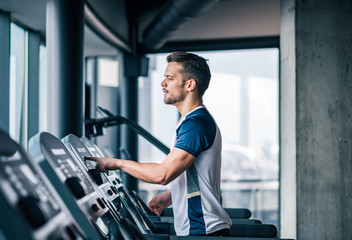 Athlete doing intensive cardio workout on treadmill.