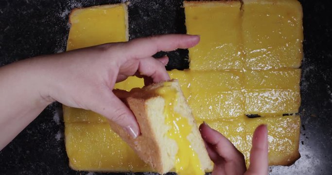 Woman Squeezing Both Sides Of Portuguese Dessert To Keep It Triangular Shaped 4K 30FPS - Triangle shaped, Desserts, International