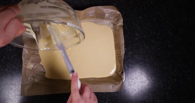 Reverse Time Lapse Of Lady Using Silicone Spatula To Scrape Off The Mixture For A Portuguese Dessert Off A Mixing Bowl 4K 30FPS - Mixture, Dessert, Sugar, Sweet, Flour