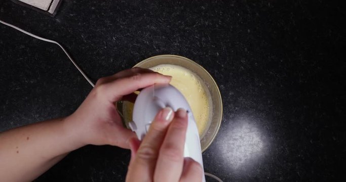 Reverse Shot Of Lady Finishing Mixing The Cake Batter To Make A Portuguese Dessert 4K 30FPS - International, Cooking, Baking