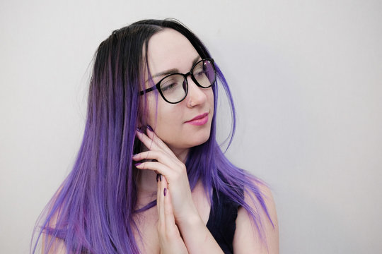 Young Woman With Purple Hair And Black Glasses.