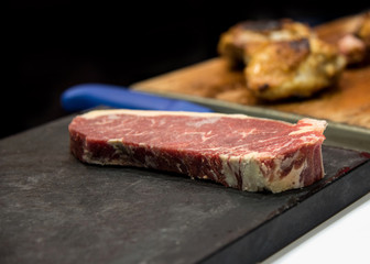 fresh cut  rib eye steak ready for grilling, copy space