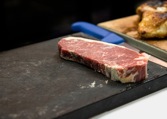 fresh cut  rib eye steak ready for grilling, copy space