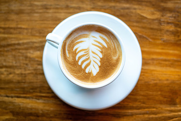 Latte hot coffee in a white cup