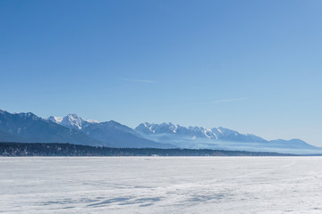 INVERMERE, CANADA - MARCH 21, 2019: town on the Windermere Lake early spring landscape.