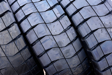 Giant new industrial coal mining rubber tires with abstract tread patterns.	