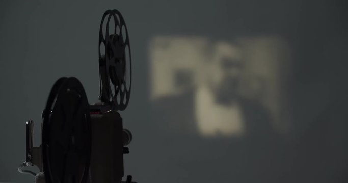 8 mm movie projector old retro old cinema in the dark room, 4K DCI