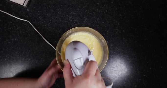 Reverse Time Lapse Of Lady Using Mixer To Mix Cake Batter To Make Portuguese Dessert 4K 30FPS - Dough, Cooking, Food, Desserts