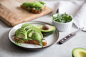 healthy breakfast with avocado and Delicious wholewheat toast. sliced avocado on toast bread with spices. Mexican cuisine