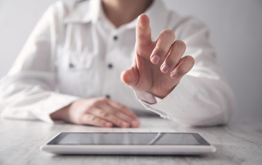 Girl using tablet. Modern office desk. Technology