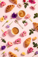 Morning coffee, croissants and a beautiful flowers . Flat lay style. 