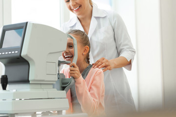 Laughing cute girl with braided hair having fun while dealing