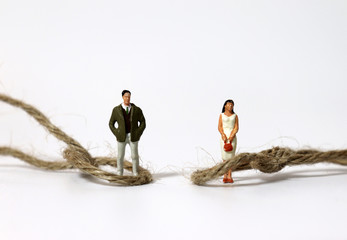 Ropes and miniature people. The concept of a conflict between male and female roles.