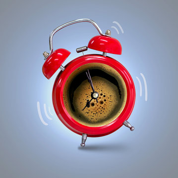 Alarm clock twin Bell-type red with espresso coffee background.