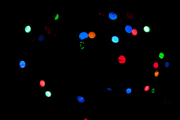 Colorful lights out of focus in the dark