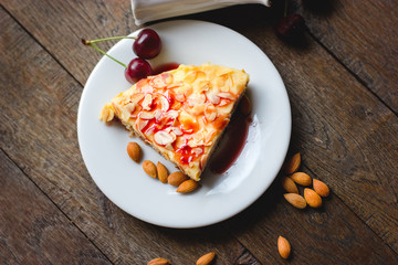 Almond cake, almond cake topped with syrup, sweet sauce of cherries