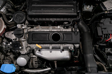 Close up detail of new car engine Car engine part. Close-up image of an internal combustion engine.