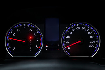 Interior view of car with black salon. Modern luxury prestige car interior: speedometer, dashboard...