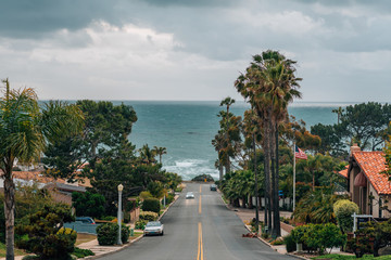 A street with view of the Pacific Ocean on a cloudy day, in Point Loma, San Diego, California