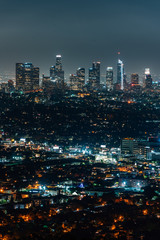 Cityscape view of the downtown skyline at night, from Griffith Observatory, in Los Angeles,...