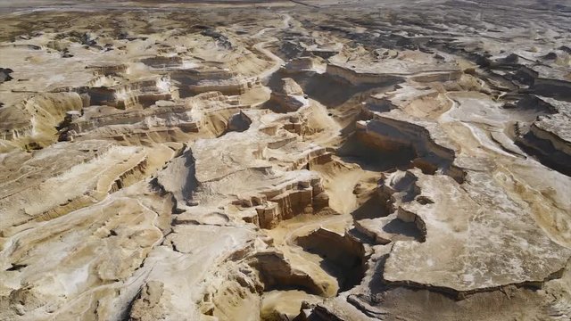 view of canyon from the top. canyon cliffs against the sky. Midbar Yehuda. drone flight over the Judean desert between the dead sea and Massada. Israel. 4k