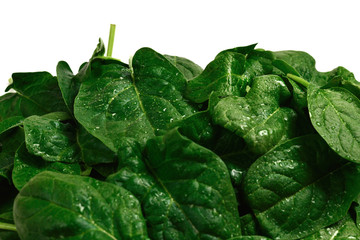 Fresh spinach leaves as background.