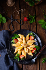 Kopytka - polish potato dumpling with strawberries