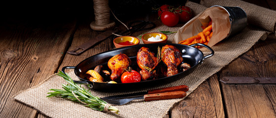 grilled chicken legs in barbecue marinade with sweet potatoes