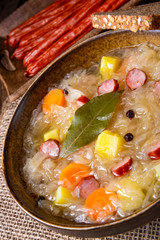 rustic sauerkraut soup with bacon and sausage