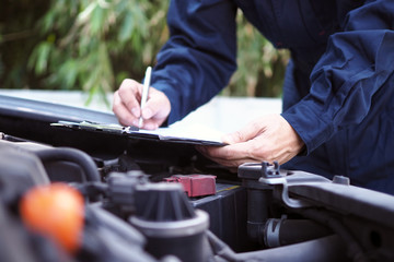 The engine engineer is checking and repairing the car. Off-site care services