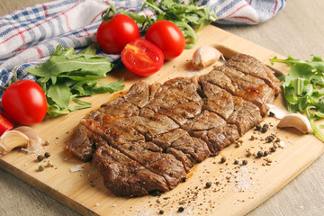 A beef steak well done with vegetables	
