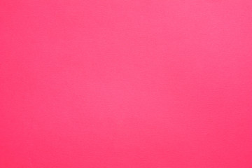 Hot pink felt texture abstract art background. Solid color construction paper surface. Empty space.