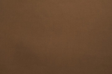 Brown felt texture abstract art background. Solid color construction paper surface. Empty space.