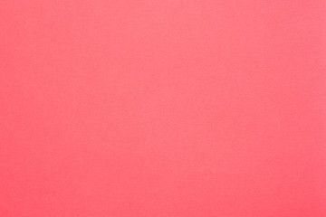 Coral red felt texture abstract art background. Solid color construction paper surface. Copy space.
