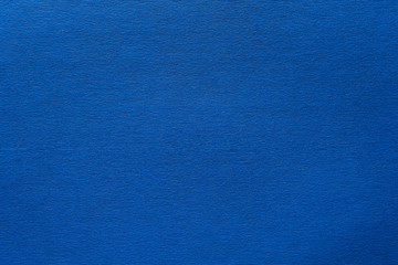 Blue felt texture abstract art background. Corduroy textile pattern surface. Copy space.