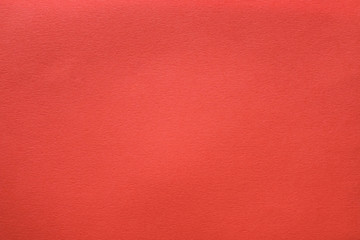 Coral red felt texture abstract art background. Shaggy material surface. Copy space.