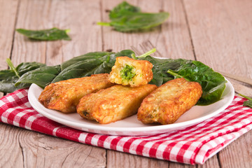 Potato croquettes with spinach and mozzarella. 