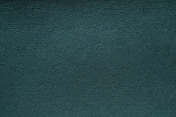 Dark teal green felt texture abstract art background. Corduroy textile pattern surface. Copy space.