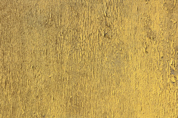 Yellow cracked surface - abstract background.