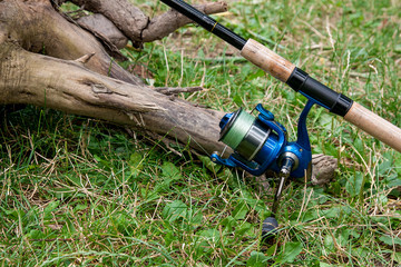 Fishing rods with reels on the natural background.