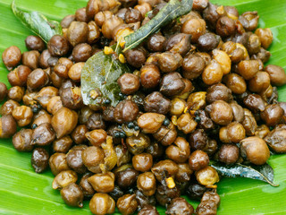 Indian peas fried in oil with spices on a banana leaf in Kochi, Kerala