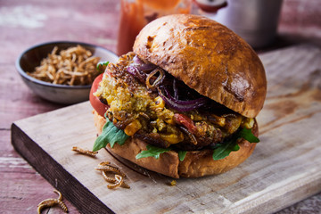Speciality gourmet fried mealworm insect burger