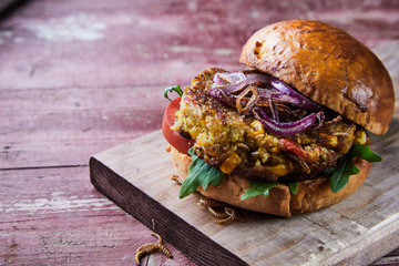 Close up on a fried mealworm insect burger