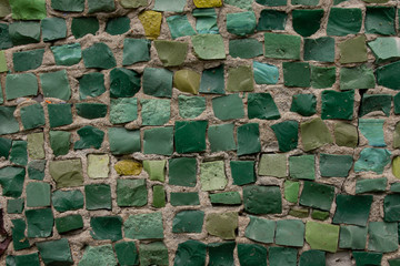 shades of green stone mosaic wall