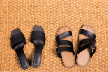 Cleaning foot carpet with sandals welcome home