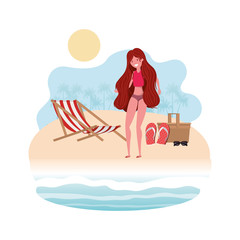 woman on the shore of the beach with picnic basket