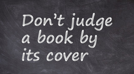 Don’t judge a book by its cover written on blackboard