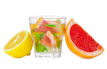 cold drink with different citrus and herbs in glasses on a white background. Cocktail