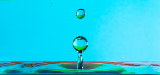water droplet falling and shaping splashes
