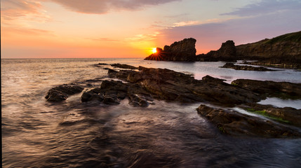 Fototapeta premium Dramatic sunrise on the beach with rocks, Sinemorets, Bulgaria - Image